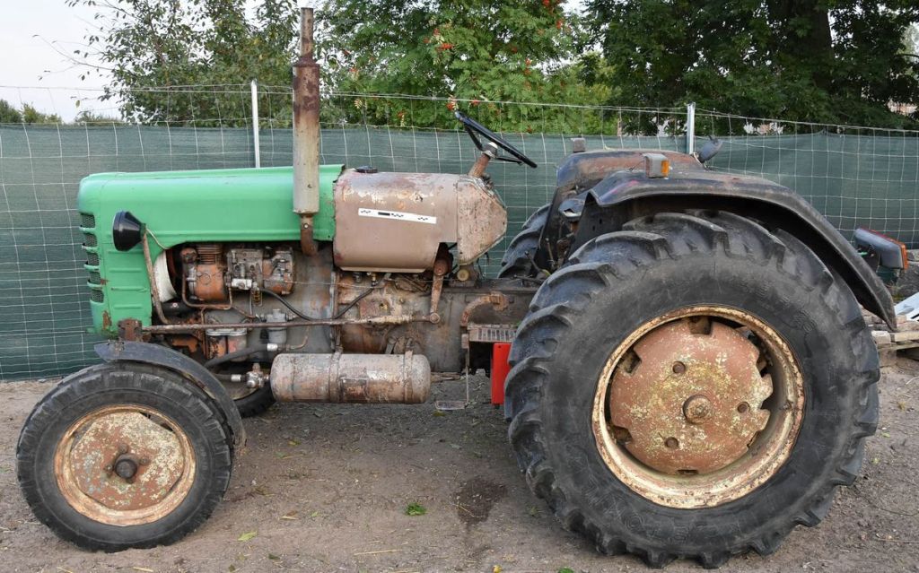 wypadek, ciągnik, przejechanie, ranny mężczyzna